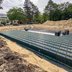 Vorschau: Die Speicherboxen werden von einer Folie eingeschlagen. Diese wird im Anschluss so verschweißt, dass das zurückgehaltene Regenwasser nur an ausgewählten Punkten entweichen kann. Foto: Sascha Stüber